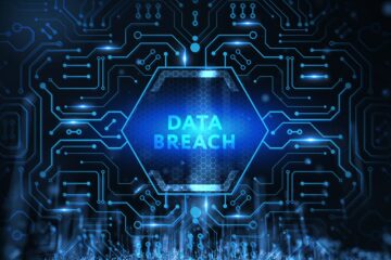 Data breach photo with mechanical designs; business law orange county