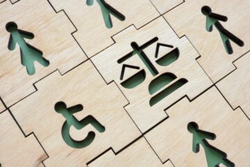 puzzle peices with disabled signs; orange county busines law